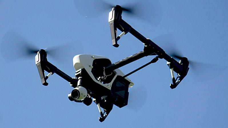 Drone flying infront of clear sky